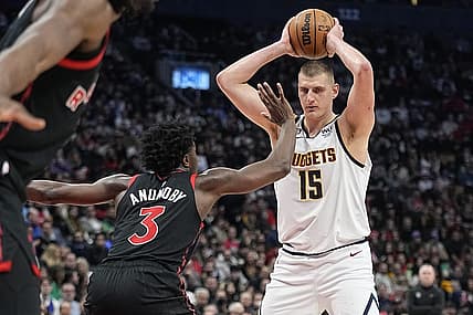 Mar 14, 2023; Toronto, Ontario, CAN; Toronto Raptors forward O.G. Anunoby (3) defends against Denver Nuggets center Nikola Jokic (15) during the second half at Scotiabank Arena. Mandatory Credit: John E. Sokolowski-USA TODAY Sports