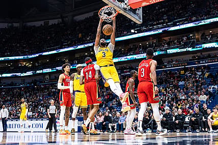 Mar 14, 2023; New Orleans, Louisiana, USA; Los Angeles Lakers forward Anthony Davis (3) dunks the ball against New Orleans Pelicans forward Brandon Ingram (14) during the second half at Smoothie King Center. Mandatory Credit: Stephen Lew-USA TODAY Sports