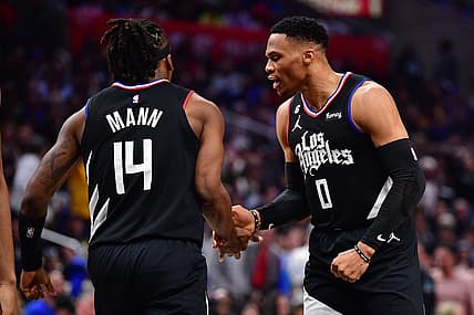 Mar 15, 2023; Los Angeles, California, USA; Los Angeles Clippers guard Russell Westbrook (0) reacts after guard Terance Mann (14) scores a basket and draws the foul against the Golden State Warriors during the second half at Crypto.com Arena. Mandatory Credit: Gary A. Vasquez-USA TODAY Sports