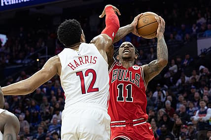 Mar 20, 2023; Philadelphia, Pennsylvania, USA; Chicago Bulls forward DeMar DeRozan (11) drives for a shot against Philadelphia 76ers forward Tobias Harris (12) during overtime at Wells Fargo Center. Mandatory Credit: Bill Streicher-USA TODAY Sports