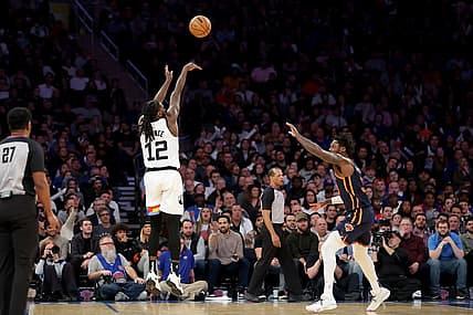 Mar 20, 2023; New York, New York, USA; Minnesota Timberwolves forward Taurean Prince (12) shoots a three point shot over New York Knicks forward Julius Randle (30) during the fourth quarter at Madison Square Garden. Mandatory Credit: Brad Penner-USA TODAY Sports