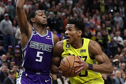 Mar 20, 2023; Salt Lake City, Utah, USA; Utah Jazz guard Ochai Agbaji (30) drives against Sacramento Kings guard De'Aaron Fox (5) in the fourth quarter at Vivint Arena. Mandatory Credit: Rob Gray-USA TODAY Sports