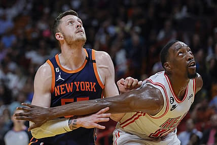 Mar 22, 2023; Miami, Florida, USA; New York Knicks center Isaiah Hartenstein (55) and Miami Heat center Bam Adebayo (13) defend during a free-throw attempt in the second quarter at Miami-Dade Arena. Mandatory Credit: Sam Navarro-USA TODAY Sports