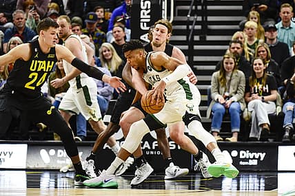 Mar 24, 2023; Salt Lake City, Utah, USA; Milwaukee Bucks forward Giannis Antetokounmpo (34) drives into Utah Jazz forward/center Kelly Olynyk (41) during the first half at Vivint Arena. Mandatory Credit: Christopher Creveling-USA TODAY Sports