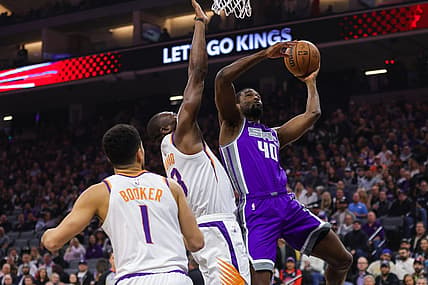 Mar 24, 2023; Sacramento, California, USA; Sacramento Kings forward Harrison Barnes (40) drives to the basket against Phoenix Suns center Bismack Biyombo (18) during the first quarter at Golden 1 Center. Mandatory Credit: Sergio Estrada-USA TODAY Sports