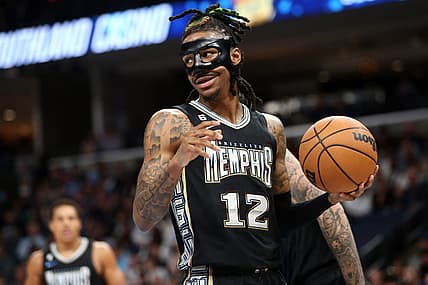 Mar 24, 2023; Memphis, Tennessee, USA; Memphis Grizzlies guard Ja Morant (12) collects the ball during the first half against the Houston Rockets at FedExForum. Mandatory Credit: Petre Thomas-USA TODAY Sports