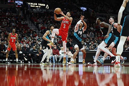 Mar 27, 2023; Portland, Oregon, USA; New Orleans Pelicans shooting guard CJ McCollum (3) drives to the basket past Portland Trail Blazers shooting guard Keon Johnson (6) during the first half at Moda Center. Mandatory Credit: Soobum Im-USA TODAY Sports