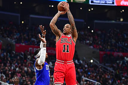 Mar 27, 2023; Los Angeles, California, USA; Chicago Bulls forward DeMar DeRozan (11) shoots against Los Angeles Clippers forward Robert Covington (23) during the first half at Crypto.com Arena. Mandatory Credit: Gary A. Vasquez-USA TODAY Sports