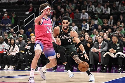 Mar 28, 2023; Washington, District of Columbia, USA; Boston Celtics forward Jayson Tatum (0) dribbles as Washington Wizards forward Corey Kispert (24) defends during the first half at Capital One Arena. Mandatory Credit: Brad Mills-USA TODAY Sports