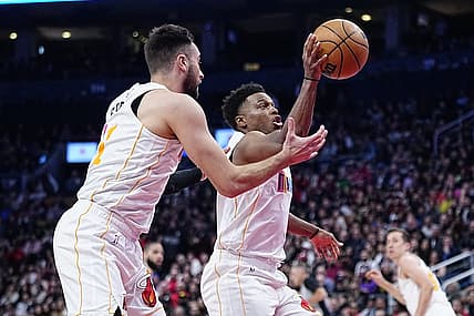 Mar 28, 2023; Toronto, Ontario, CAN; Miami Heat guard Kyle Lowry (7) and guard Max Strus (31) battle for a rebound against the Toronto Raptors during the second half at Scotiabank Arena. Mandatory Credit: John E. Sokolowski-USA TODAY Sports