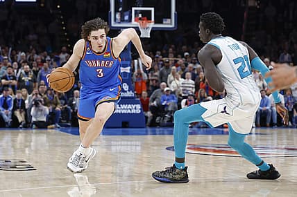 Mar 28, 2023; Oklahoma City, Oklahoma, USA; Oklahoma City Thunder guard Josh Giddey (3) drives to the basket against Charlotte Hornets forward JT Thor (21) during the second half at Paycom Center. Charlotte won 137-134. Mandatory Credit: Alonzo Adams-USA TODAY Sports