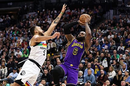 Mar 31, 2023; Minneapolis, Minnesota, USA; Los Angeles Lakers forward LeBron James (6) shoots while Minnesota Timberwolves forward Kyle Anderson (5) defends during the first quarter at Target Center. Mandatory Credit: Matt Krohn-USA TODAY Sports