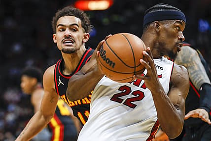Jan 14, 2022; Miami, Florida, USA; Miami Heat forward Jimmy Butler (22) protects the ball from Atlanta Hawks guard Trae Young (11) during the second quarter of the game at FTX Arena. Mandatory Credit: Sam Navarro-USA TODAY Sports