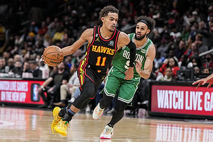 Nov 16, 2022; Atlanta, Georgia, USA; Atlanta Hawks guard Trae Young (11) dribbles past Boston Celtics guard Derrick White (9) during the second half at State Farm Arena. Mandatory Credit: Dale Zanine-USA TODAY Sports