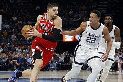 Feb 7, 2023; Memphis, Tennessee, USA; Chicago Bulls center Nikola Vucevic (9) drives to the basket as Memphis Grizzlies guard Desmond Bane (22) defends during the second half at FedExForum. Mandatory Credit: Petre Thomas-USA TODAY Sports