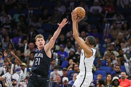 Mar 26, 2023; Orlando, Florida, USA; Brooklyn Nets forward Mikal Bridges (1) shoots the ball against Orlando Magic center Moritz Wagner (21) during the second half at Amway Center. Mandatory Credit: Mike Watters-USA TODAY Sports