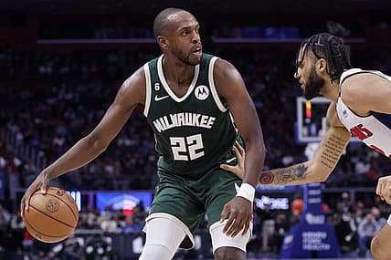Mar 27, 2023; Detroit, Michigan, USA;  Milwaukee Bucks forward Khris Middleton (22) dribbles defended by Detroit Pistons forward Isaiah Livers (12) in the second half at Little Caesars Arena. Mandatory Credit: Rick Osentoski-USA TODAY Sports