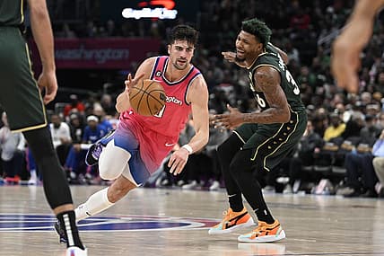 Mar 28, 2023; Washington, District of Columbia, USA; Washington Wizards forward Deni Avdija (9) dribbles past Boston Celtics guard Marcus Smart (36) during the second half at Capital One Arena. Mandatory Credit: Brad Mills-USA TODAY Sports