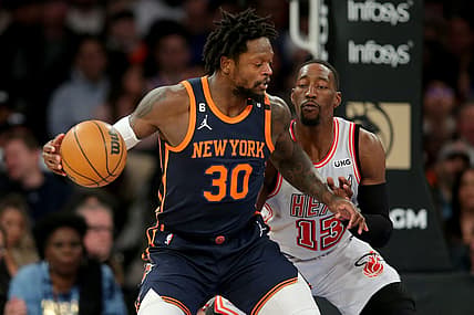 Mar 29, 2023; New York, New York, USA; New York Knicks forward Julius Randle (30) controls the ball against Miami Heat center Bam Adebayo (13) during the first quarter at Madison Square Garden. Mandatory Credit: Brad Penner-USA TODAY Sports