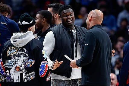 Mar 30, 2023; Denver, Colorado, USA; New Orleans Pelicans forward Zion Williamson (C) talks with guard Jose Alvarado (L) and assistant coach Fred Vinson (R) in the second quarter against the Denver Nuggets at Ball Arena. Mandatory Credit: Isaiah J. Downing-USA TODAY Sports
