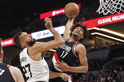 Apr 2, 2023; Minneapolis, Minnesota, USA; Portland Trail Blazers guard Shaedon Sharpe (17) looks to dunk on Minnesota Timberwolves center Rudy Gobert (27) in the first quarter at Target Center. Mandatory Credit: Bruce Kluckhohn-USA TODAY Sports