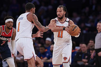 Apr 2, 2023; New York, New York, USA; New York Knicks guard Jalen Brunson (11) sets the ball for forward Obi Toppin (1) in front of Washington Wizards guard Jordan Goodwin (7) during the second half at Madison Square Garden. Mandatory Credit: Vincent Carchietta-USA TODAY Sports