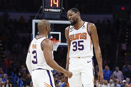 Apr 2, 2023; Oklahoma City, Oklahoma, USA; Phoenix Suns guard Chris Paul (3) and forward Kevin Durant (35) talk during the second half against the Oklahoma City Thunder at Paycom Center. Phoenix won 128-118. Mandatory Credit: Alonzo Adams-USA TODAY Sports