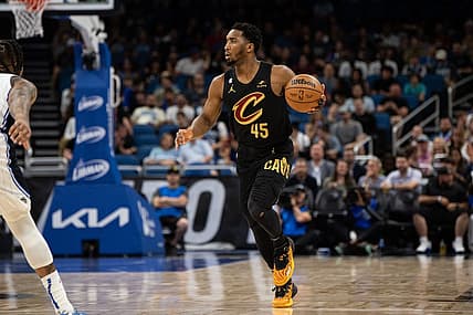 Apr 4, 2023; Orlando, Florida, USA; Cleveland Cavaliers guard Donovan Mitchell looks to pass against the Orlando Magic at Amway Center. Mandatory Credit: Jeremy Reper-USA TODAY Sports