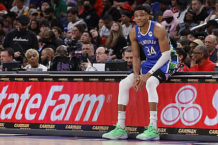 Apr 4, 2023; Washington, District of Columbia, USA; Milwaukee Bucks forward Giannis Antetokounmpo (34) sits on the scorers table against the Washington Wizards in the fourth quarter at Capital One Arena. Mandatory Credit: Geoff Burke-USA TODAY Sports