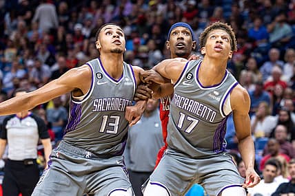 Apr 4, 2023; New Orleans, Louisiana, USA;  Sacramento Kings forward Keegan Murray (13) and forward Kessler Edwards hold back New Orleans Pelicans guard Josh Richardson (2) on a rebound during the second half at Smoothie King Center. Mandatory Credit: Stephen Lew-USA TODAY Sports