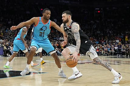 Apr 4, 2023; Phoenix, Arizona, USA; San Antonio Spurs forward Sandro Mamukelashvili (54) drives on Phoenix Suns forward T.J. Warren (21) in the second half at Footprint Center. Mandatory Credit: Rick Scuteri-USA TODAY Sports