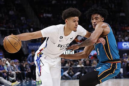 Apr 5, 2023; Detroit, Michigan, USA;  Brooklyn Nets forward Cameron Johnson (2) dribbles on Detroit Pistons guard Jared Rhoden (8) in the first half at Little Caesars Arena. Mandatory Credit: Rick Osentoski-USA TODAY Sports