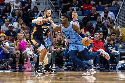 Apr 5, 2023; New Orleans, Louisiana, USA;  Memphis Grizzlies forward Jaren Jackson Jr. (13) dribbles against New Orleans Pelicans center Jonas Valanciunas (17) during the first half at Smoothie King Center. Mandatory Credit: Stephen Lew-USA TODAY Sports