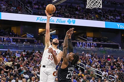 Apr 6, 2023; Orlando, Florida, USA; Cleveland Cavaliers forward Isaiah Mobley (15) shoots the ball over Orlando Magic forward Admiral Schofield (25) during the second quarter at Amway Center. Mandatory Credit: Mike Watters-USA TODAY Sports
