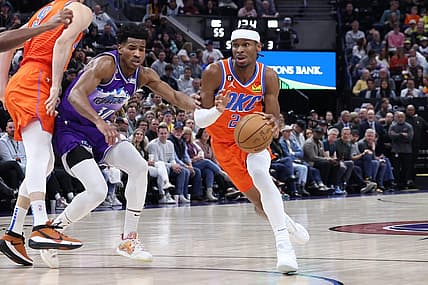 Apr 6, 2023; Salt Lake City, Utah, USA; Oklahoma City Thunder guard Shai Gilgeous-Alexander (2) moves past Utah Jazz guard Ochai Agbaji (30) in the second quarter at Vivint Arena. Mandatory Credit: Rob Gray-USA TODAY Sports