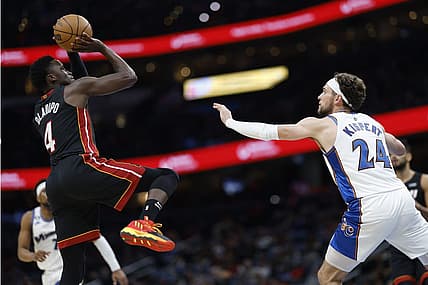 Apr 7, 2023; Washington, District of Columbia, USA; Miami Heat guard Victor Oladipo (4) shoots the ball over Washington Wizards forward Corey Kispert (24) in the second quarterat Capital One Arena. Mandatory Credit: Geoff Burke-USA TODAY Sports
