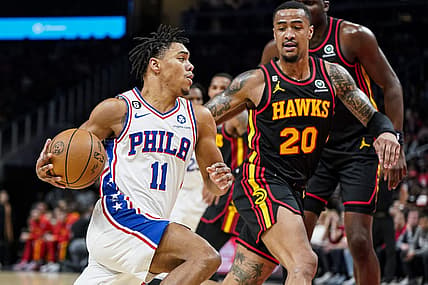 Apr 7, 2023; Atlanta, Georgia, USA; Philadelphia 76ers guard Jaden Springer (11) drives to the basket against Atlanta Hawks forward John Collins (20) during the first half at State Farm Arena. Mandatory Credit: Dale Zanine-USA TODAY Sports