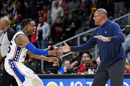 Apr 7, 2023; Atlanta, Georgia, USA;  Philadelphia 76ers forward Danuel House Jr. (25) and head coach Glenn Rivers react during a timeout during the game against the Atlanta Hawks during overtime at State Farm Arena. Mandatory Credit: Dale Zanine-USA TODAY Sports