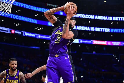 Apr 7, 2023; Los Angeles, California, USA; Los Angeles Lakers forward Anthony Davis (3) gets the rebound against the Phoenix Suns during the second half at Crypto.com Arena. Mandatory Credit: Gary A. Vasquez-USA TODAY Sports