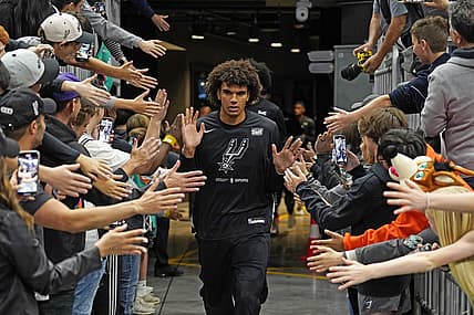 Apr 8, 2023; Austin, Texas, USA; San Antonio Spurs forward Dominick Barlow (26) greets fans on his way to the court before the game against the Minnesota Timberwolves at Moody Center. Mandatory Credit: Scott Wachter-USA TODAY Sports