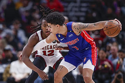 Apr 9, 2023; Chicago, Illinois, USA; Chicago Bulls guard Ayo Dosunmu (12) defends against Detroit Pistons guard Killian Hayes (7) during the first half at United Center. Mandatory Credit: Kamil Krzaczynski-USA TODAY Sports