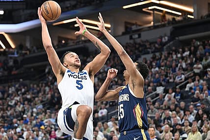 Apr 9, 2023; Minneapolis, Minnesota, USA; Minnesota Timberwolves forward Kyle Anderson (5) goes to the basket as New Orleans Pelicans guard Trey Murphy III (25) defends during the second quarter at Target Center. Mandatory Credit: Jeffrey Becker-USA TODAY Sports