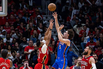 Apr 12, 2023; New Orleans, Louisiana, USA; Oklahoma City Thunder guard Josh Giddey (3) shoots a jump shot over New Orleans Pelicans guard CJ McCollum (3) during the second half at Smoothie King Center. Mandatory Credit: Stephen Lew-USA TODAY Sports