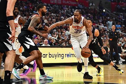 Apr 22, 2023; Los Angeles, California, USA; Phoenix Suns forward Kevin Durant (35) moves to the basket against Los Angeles Clippers forward Marcus Morris Sr. (8) during the first half in game four of the 2023 NBA playoffs at Crypto.com Arena. Mandatory Credit: Gary A. Vasquez-USA TODAY Sports