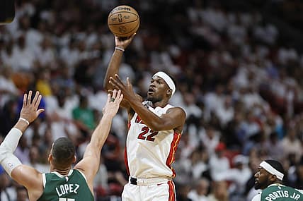 Apr 22, 2023; Miami, Florida, USA; Miami Heat forward Jimmy Butler (22) shoots the basketball over Milwaukee Bucks center Brook Lopez (11) in the first quarter during game three of the 2023 NBA Playoffs at Kaseya Center. Mandatory Credit: Sam Navarro-USA TODAY Sports