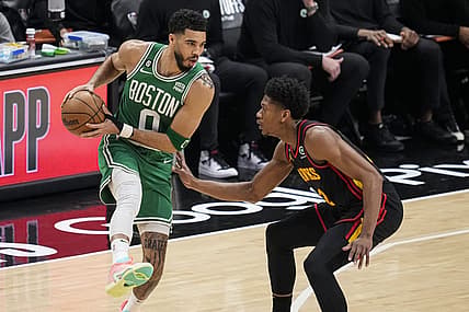 Apr 23, 2023; Atlanta, Georgia, USA; Boston Celtics forward Jayson Tatum (0) controls the ball against Atlanta Hawks forward De'Andre Hunter (12) during the first quarter during game four of the 2023 NBA playoffs at State Farm Arena. Mandatory Credit: Dale Zanine-USA TODAY Sports