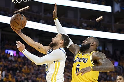 May 10, 2023; San Francisco, California, USA; Golden State Warriors guard Stephen Curry (30) shoots the basketball against Los Angeles Lakers forward LeBron James (6) during the third quarter in game five of the 2023 NBA playoffs conference semifinals round at Chase Center. Mandatory Credit: Kyle Terada-USA TODAY Sports