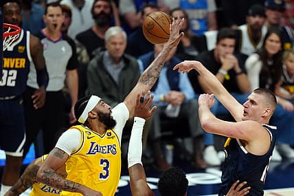 May 18, 2023; Denver, Colorado, USA; Denver Nuggets center Nikola Jokic (15) shoots against Los Angeles Lakers forward Anthony Davis (3) in the first half during game two of the Western Conference Finals for the 2023 NBA playoffs at Ball Arena. Mandatory Credit: Ron Chenoy-USA TODAY Sports