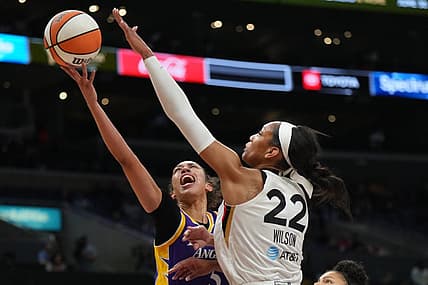 May 25, 2023; Los Angeles, California, USA; LA Sparks guard Kianna Smith (5) shoots the ball against Las Vegas Aces forward A'ja Wilson (22) during the first half at Crypto.com Arena. Mandatory Credit: Kirby Lee-USA TODAY Sports