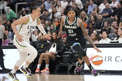 May 13, 2023; Toronto, Ontario, Canada; Chicago Sky forward Robyn Parks (21) dribbles around Minnesota Lynx guard Kayla McBride (21) during the first half at Scotiabank Arena. Mandatory Credit: John E. Sokolowski-USA TODAY Sports